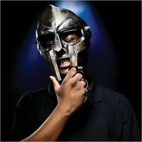 « How DOOM hold heat then preach non-violence? Shhh, he about to start the speech, c’mon, silence. »